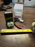 aftermarket CDI box with a 6-pin dual-plug configuration