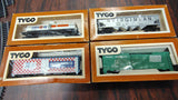 Vintage Tyco HO Scale Train Lot: 11 Boxed Cars, Santa Fe Engine, Tracks, Bridg