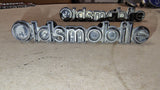1981-1984 Oldsmobile Grille Script Emblem Pair OEM GM 22507496 Delta 88 98