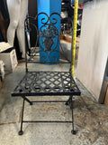 vintage Victorian style child's wrought iron folding patio chair