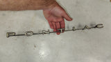 1966 Pontiac Tempest Rear Tail Panel Emblem Trim OEM GM 7611836