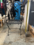 vintage Victorian style child's wrought iron folding patio chair