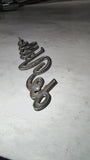 1970's Cadillac DeVille Script Emblems Pair OEM 1483604 1607891
