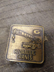 Vtg GROVE Hydraulic Cranes Brass Belt Buckle 2 x 2 inches