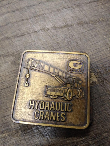 Vtg GROVE Hydraulic Cranes Brass Belt Buckle 2 x 2 inches