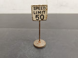 ANTIQUE METAL SPEED LIMIT 50 SIGN. MEASURES 1"BY 3"-GREAT, UNIQUE PIECE TRAIN