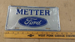 Vtg Blue Grey Metter Ford Logo Truck License Plate Tin Man Cave 94A-0096