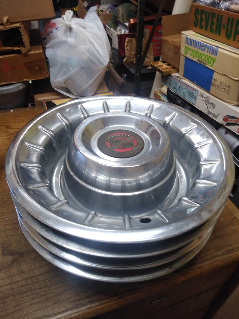 56 cadillac deals hubcaps