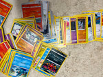 Bag full of 70+ pokemon cards various colors and characters