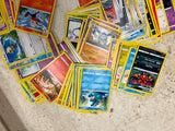 Bag full of 70+ pokemon cards various colors and characters