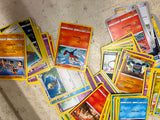 Bag full of 70+ pokemon cards various colors and characters