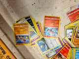Bag full of 70+ pokemon cards various colors and characters
