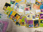 Bag of 80+ Pokémon Cards: Various Generations, colors, and characters