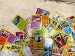 Bag of 80+ Pokémon Cards: Various Generations, colors, and characters